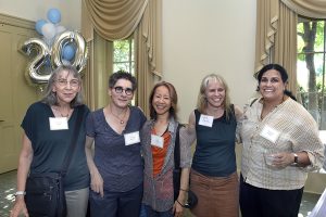 Florence Babb, Victoria Rovine, Lien Truong, Sara Smith and Shakirah Hudani smile at the Welcome Reception in the University Room of Hyde Hall