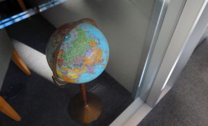 A world globe through a window.
