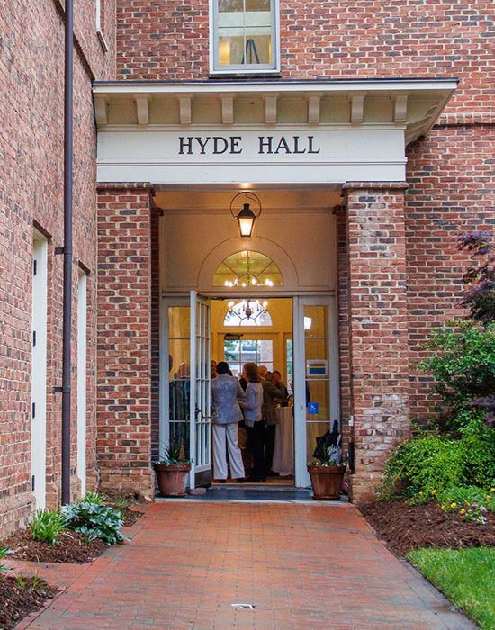 Entrance to Hyde Hall, lit from inside.