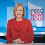 Judy Woodruff at the PBS News Hour desk.